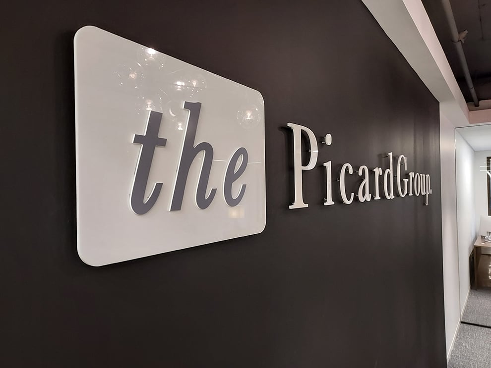 Acrylic Signs in Raleigh, NC designed and installed for business office walls and branded interiors