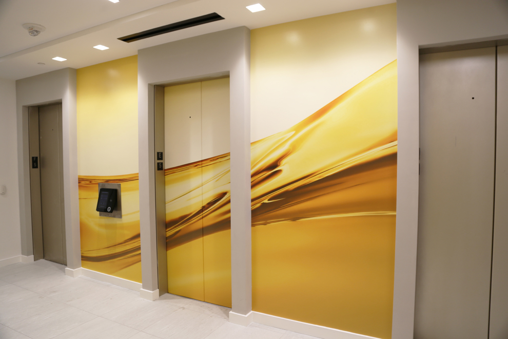 Elevator Wraps in Newport News, VA designed and installed for office branding and event environments