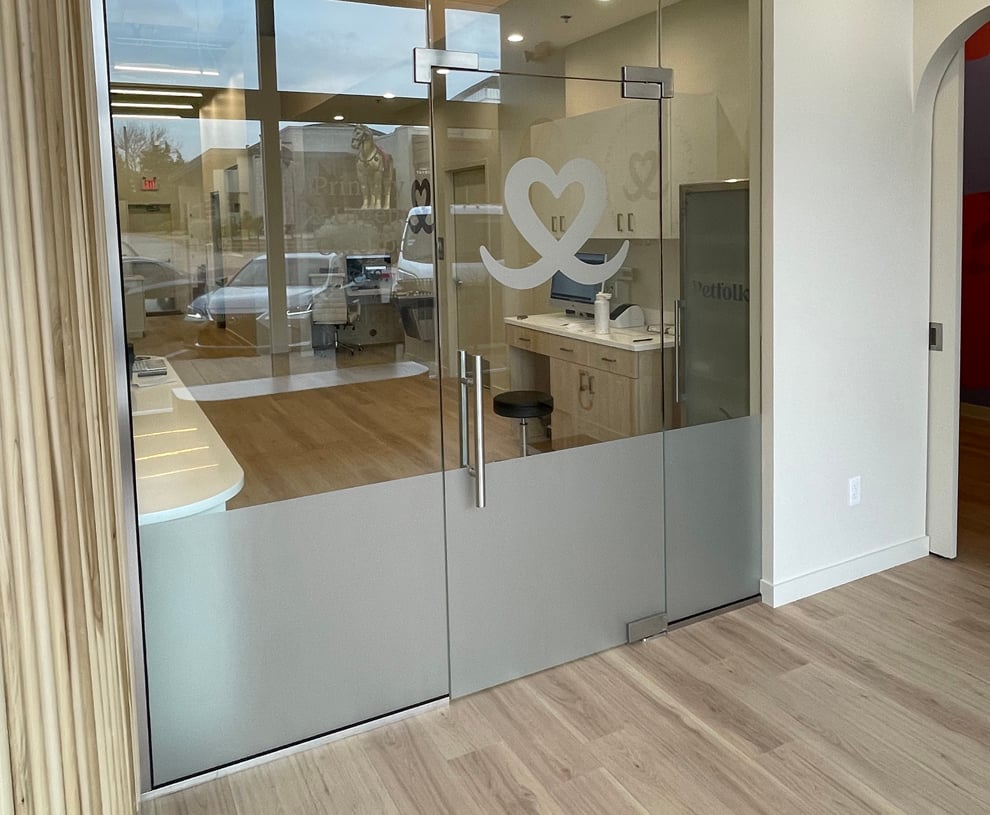Frosted Vinyl in Richmond, VA designed and installed for branded privacy glass and hallway doors