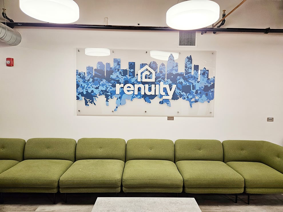 Lobby Signs Cary NC designed and installed with standoff-mounted acrylic signs for office interiors