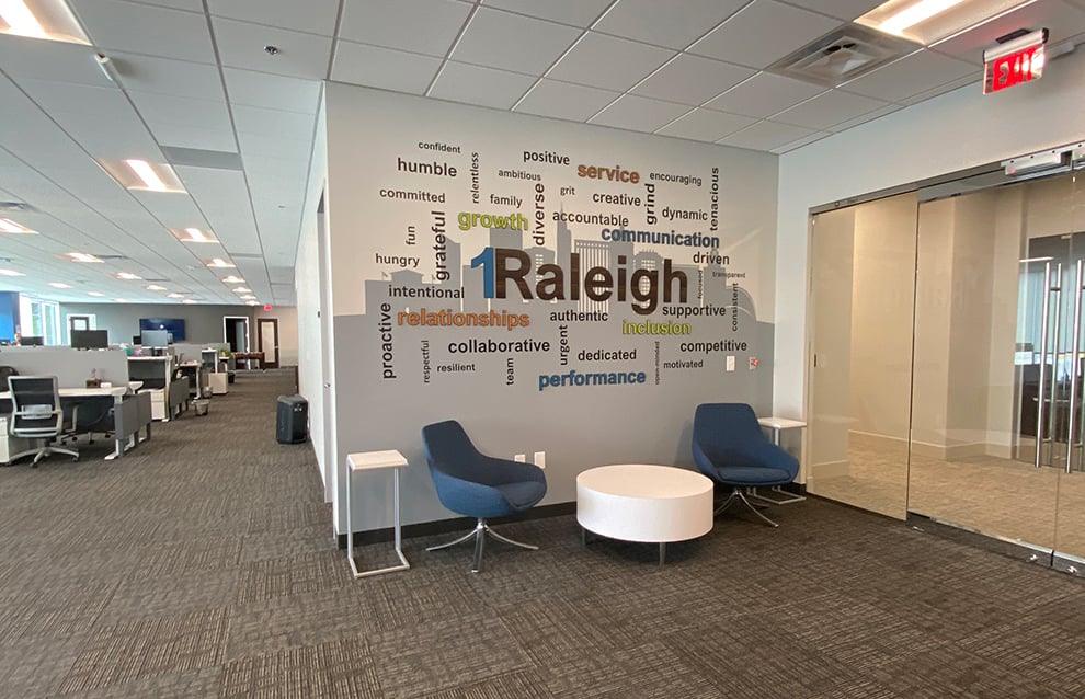 Branded mission statement wall display highlighting business values Durham, NC