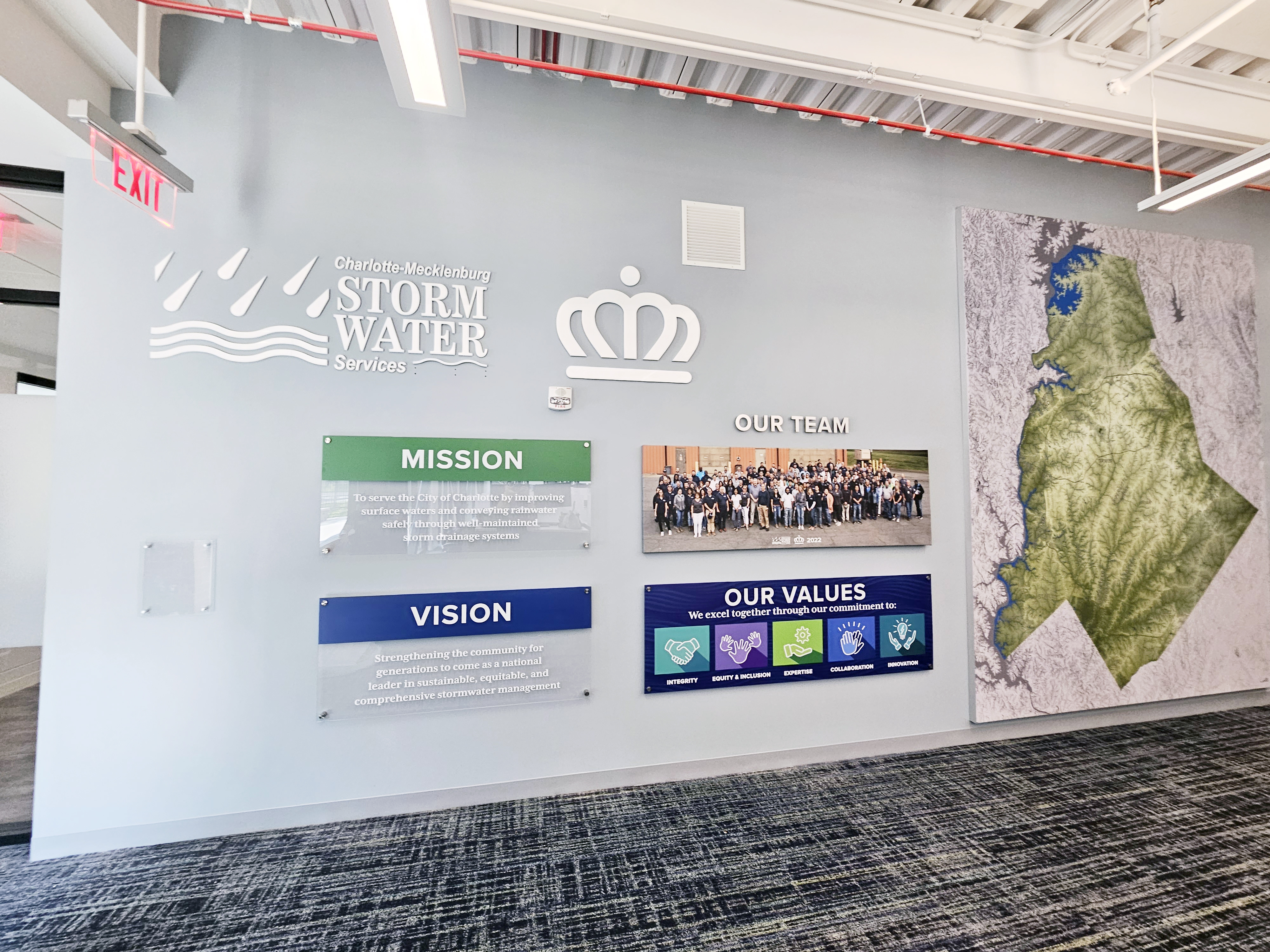 Custom mission statement wall display showcasing company culture Raleigh, NC