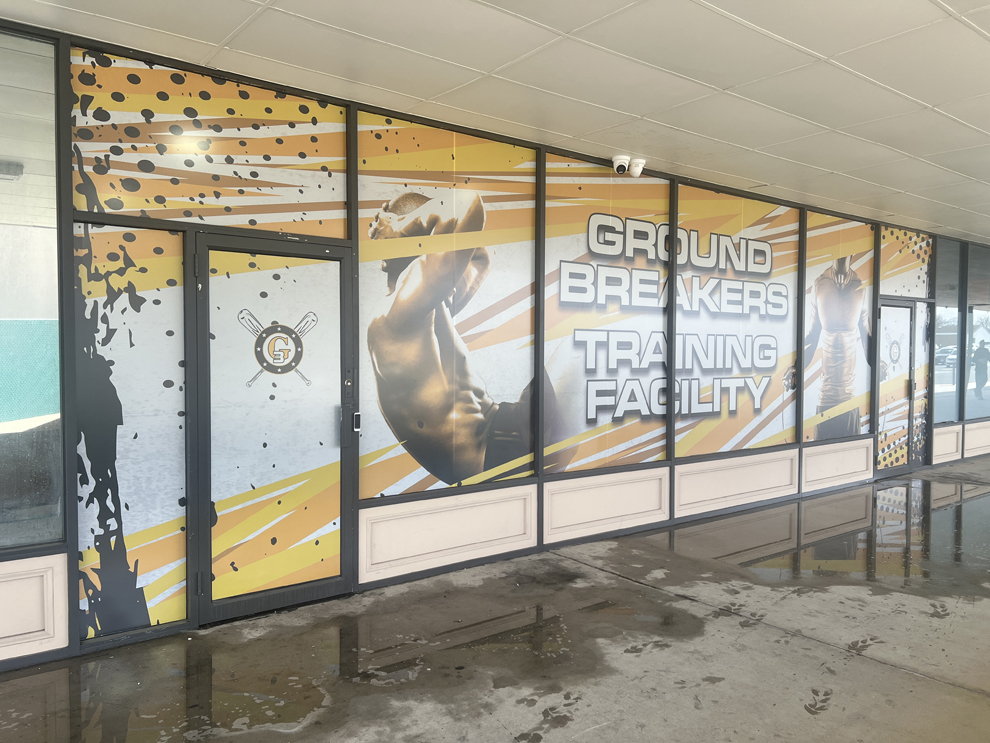Custom storefront graphics and interior signage for business near Virginia Beach, VA