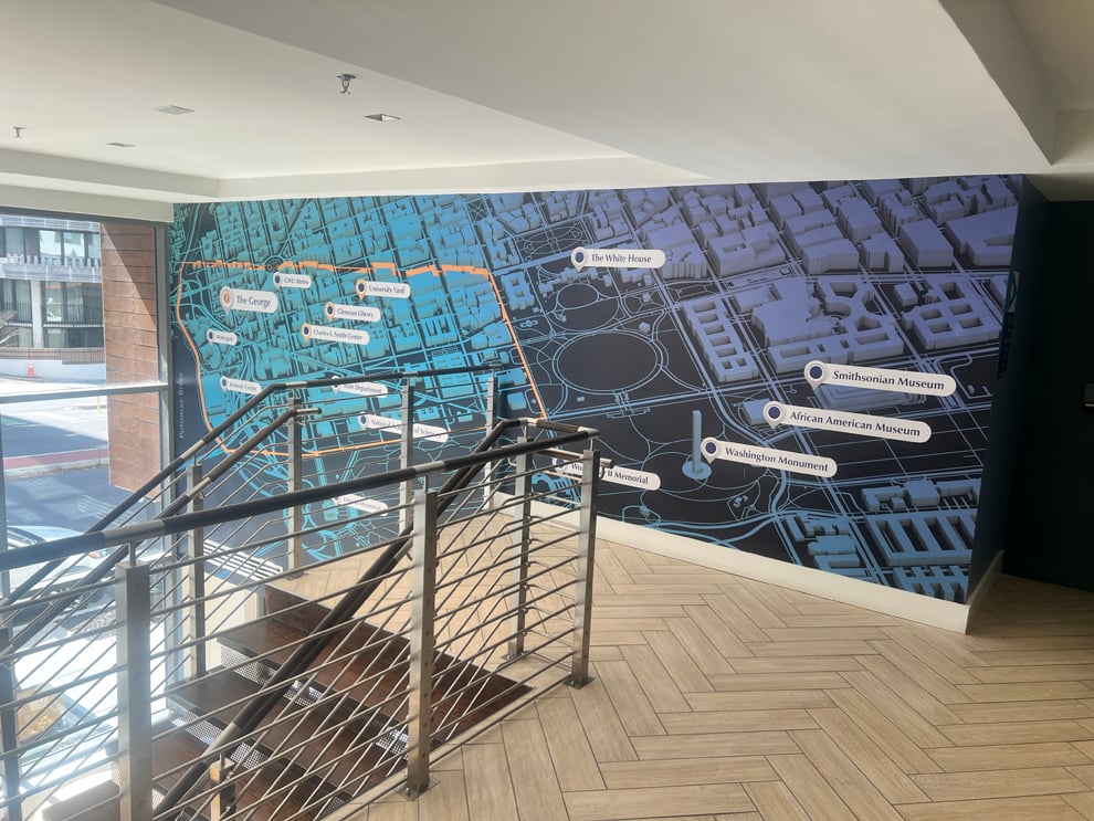Branded wall wrap mural reinforcing company culture in Chesapeake, VA office