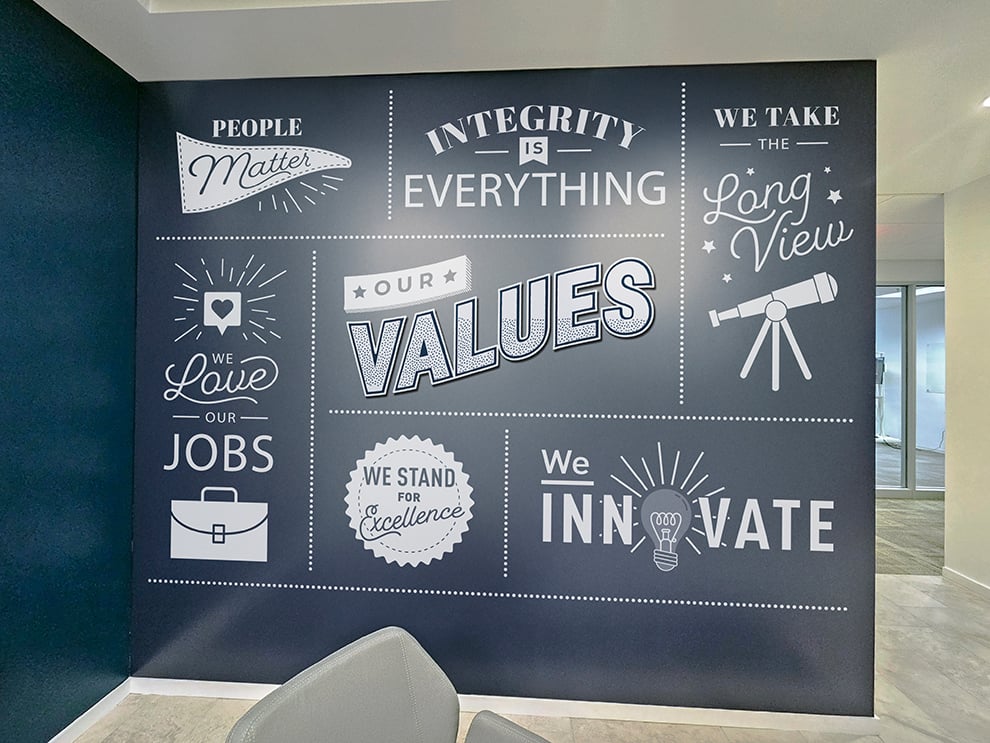 Office lobby wall wrap design for workplace branding in Decatur, GA