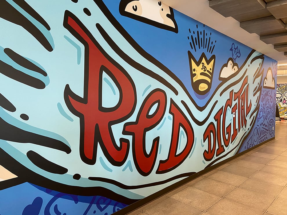 Creative workplace wall mural installation in Decatur, GA office interior