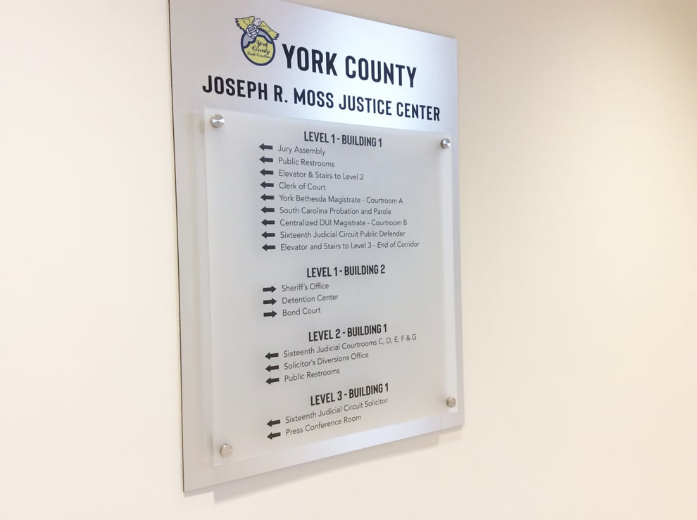 Wayfinding signs and directional graphics guiding workplace navigation in Richmond, VA