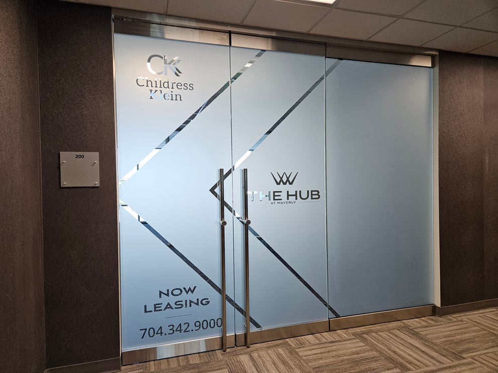 Sign Maker in Atlanta, GA designed and installed interior branding graphics and office signage