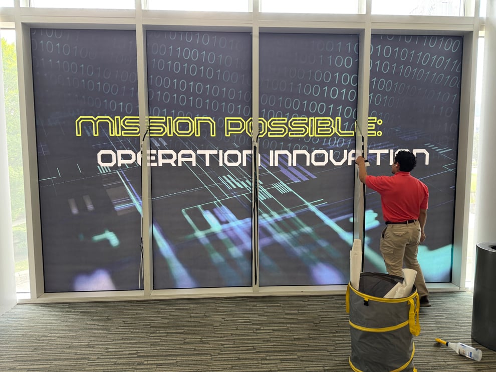 Professional office sign installation with custom graphics in Durham, NC