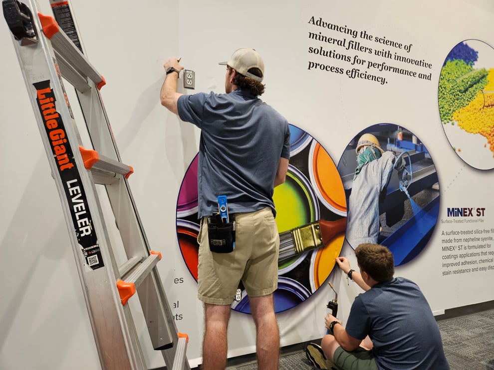 Branded wall graphics and sign installation in Newport News, VA workplace